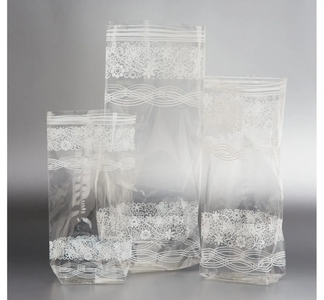 folia Backen|Bastelfolie>Zellglas-Beutel mit weißem Spitzendruck, 10 Stück